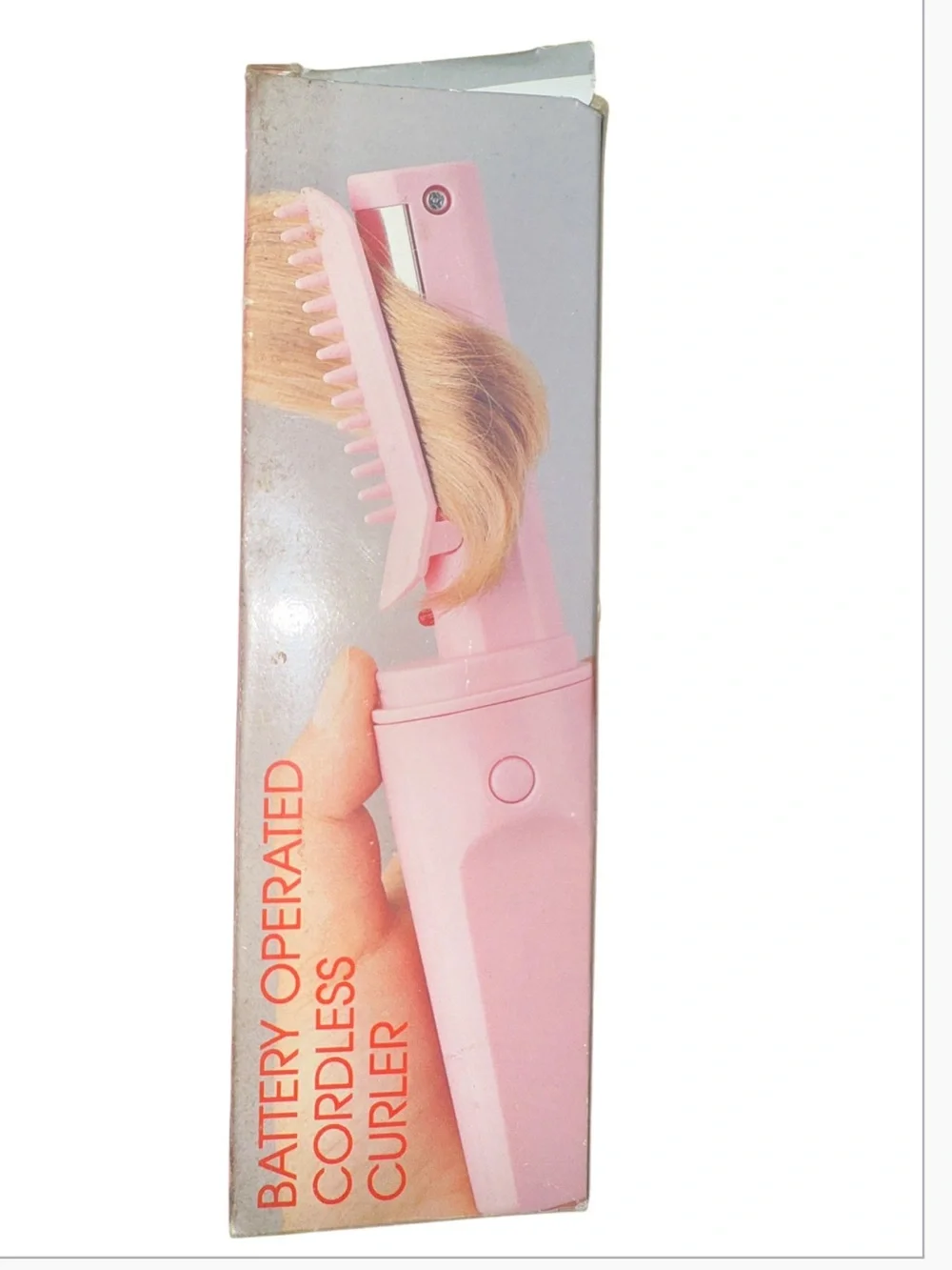 Vintage pink, portable battery-operated cordless hair curler and styling brush d